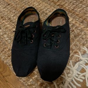 black Toms canvas shoes